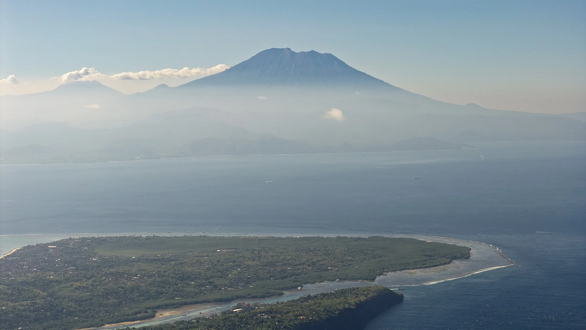 Mount Agung on Bali seen across the Badung Strait from above Nusa Lembongan
