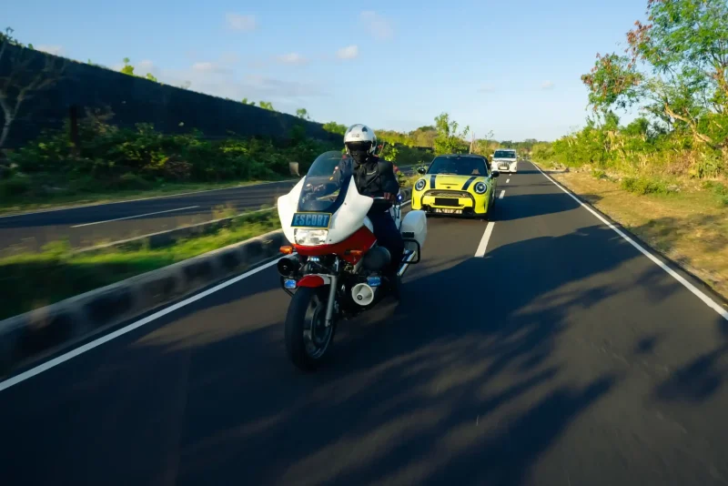 Police escort motorbike leading a convoy in Bali