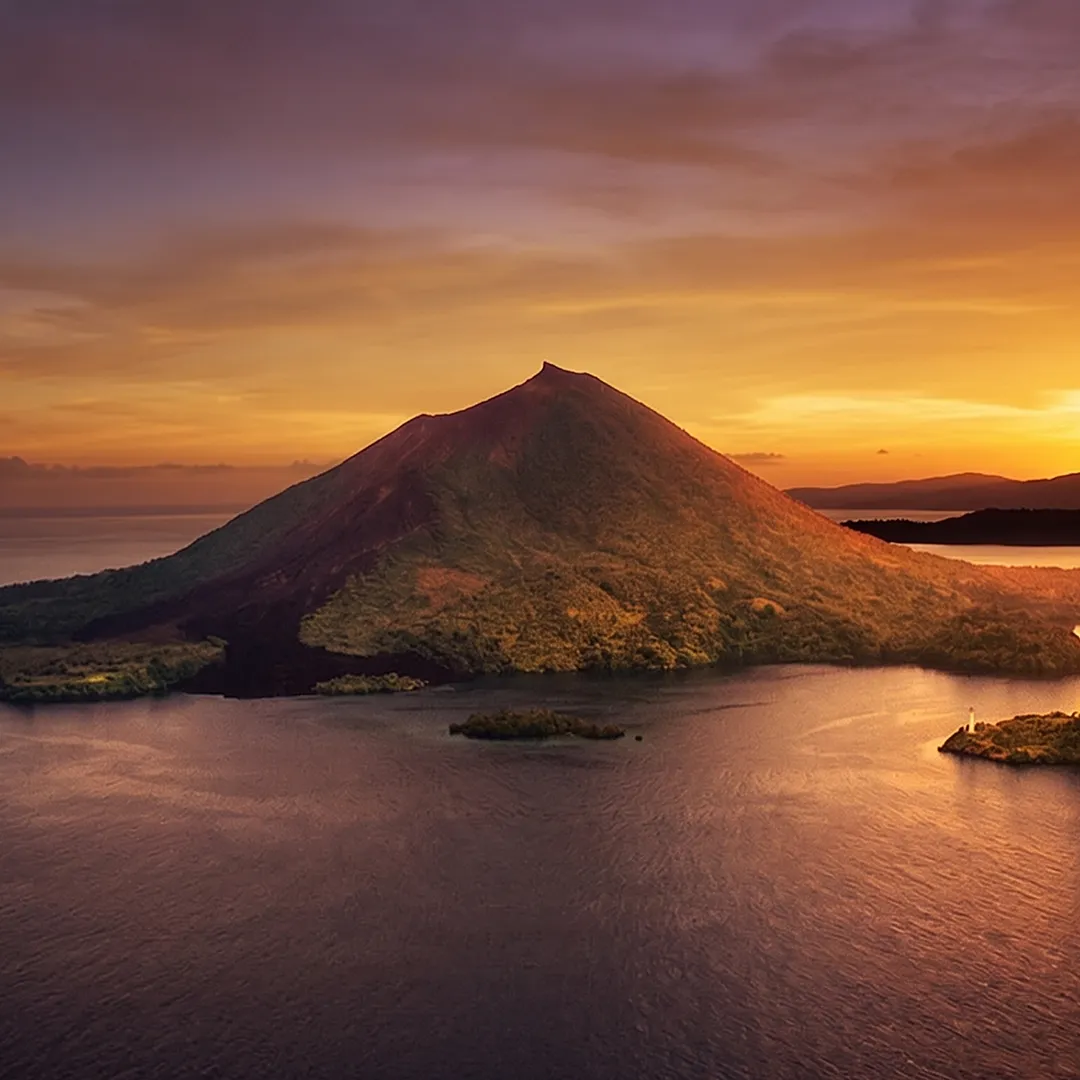 Volcanic island at sunset in eastern Indonesia