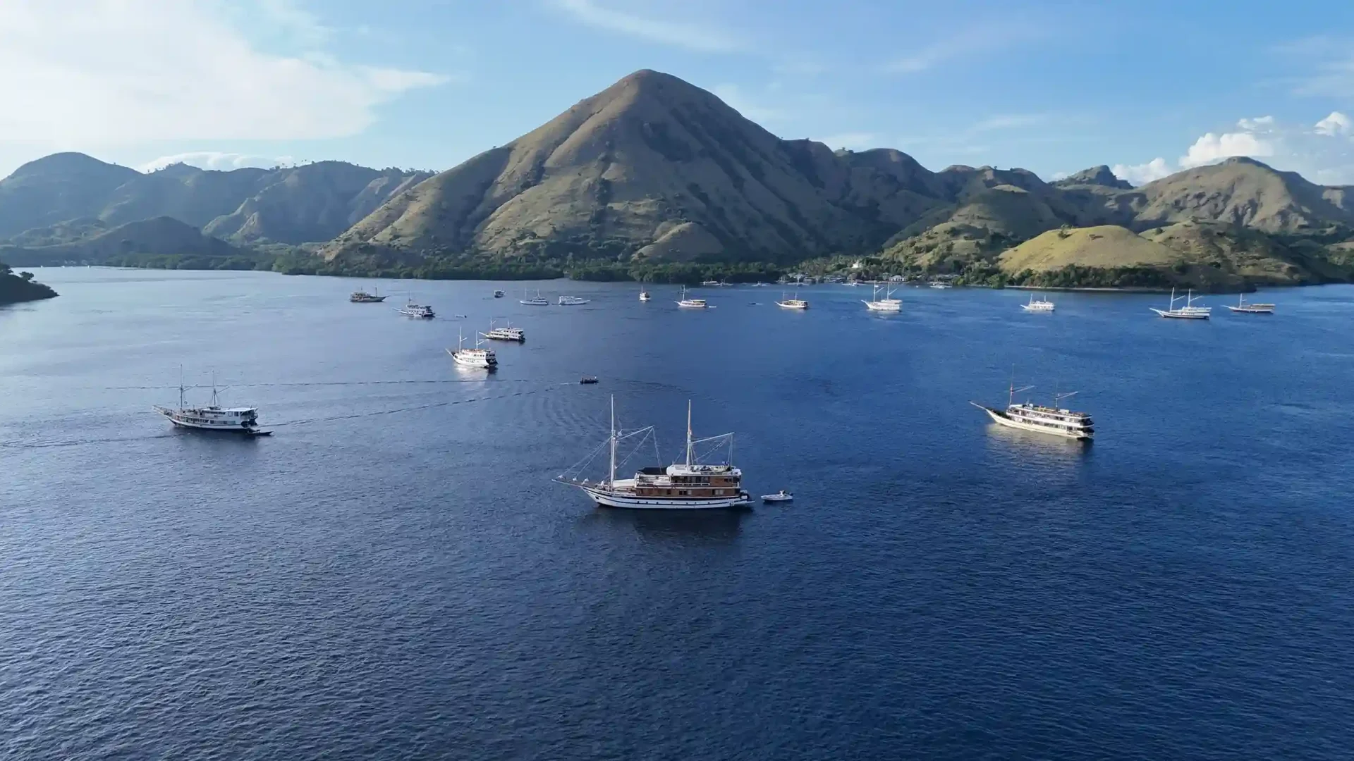 Phinisi yachts anchored in a Komodo bay