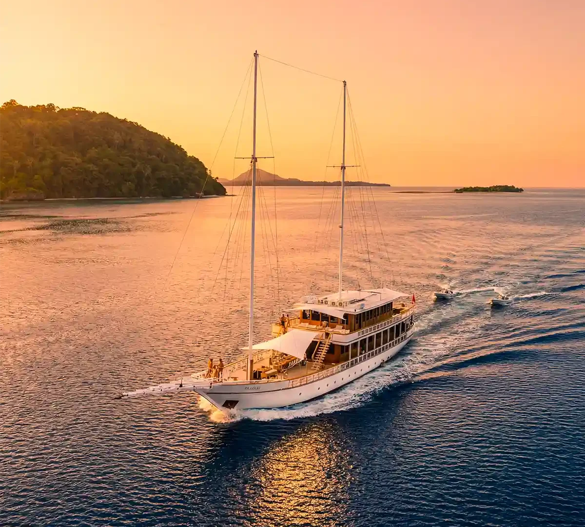 Phinisi yacht at anchor at sunset in Komodo