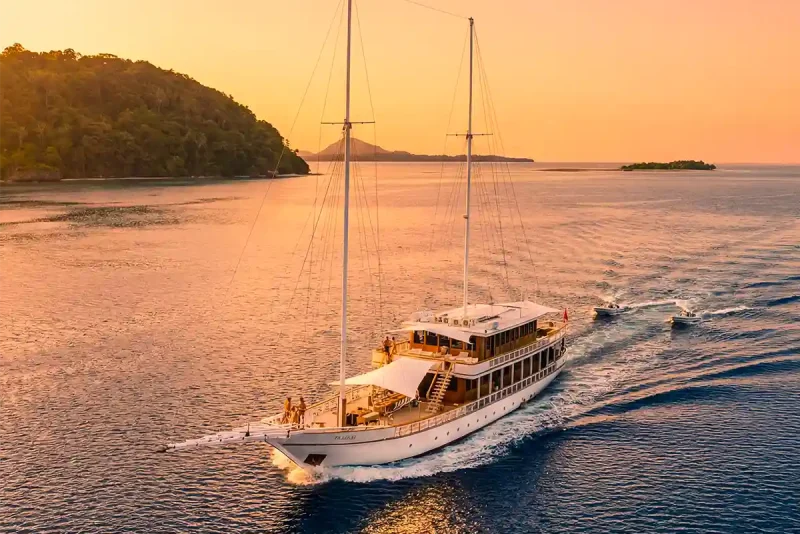 Phinisi yacht at anchor at sunset in Komodo