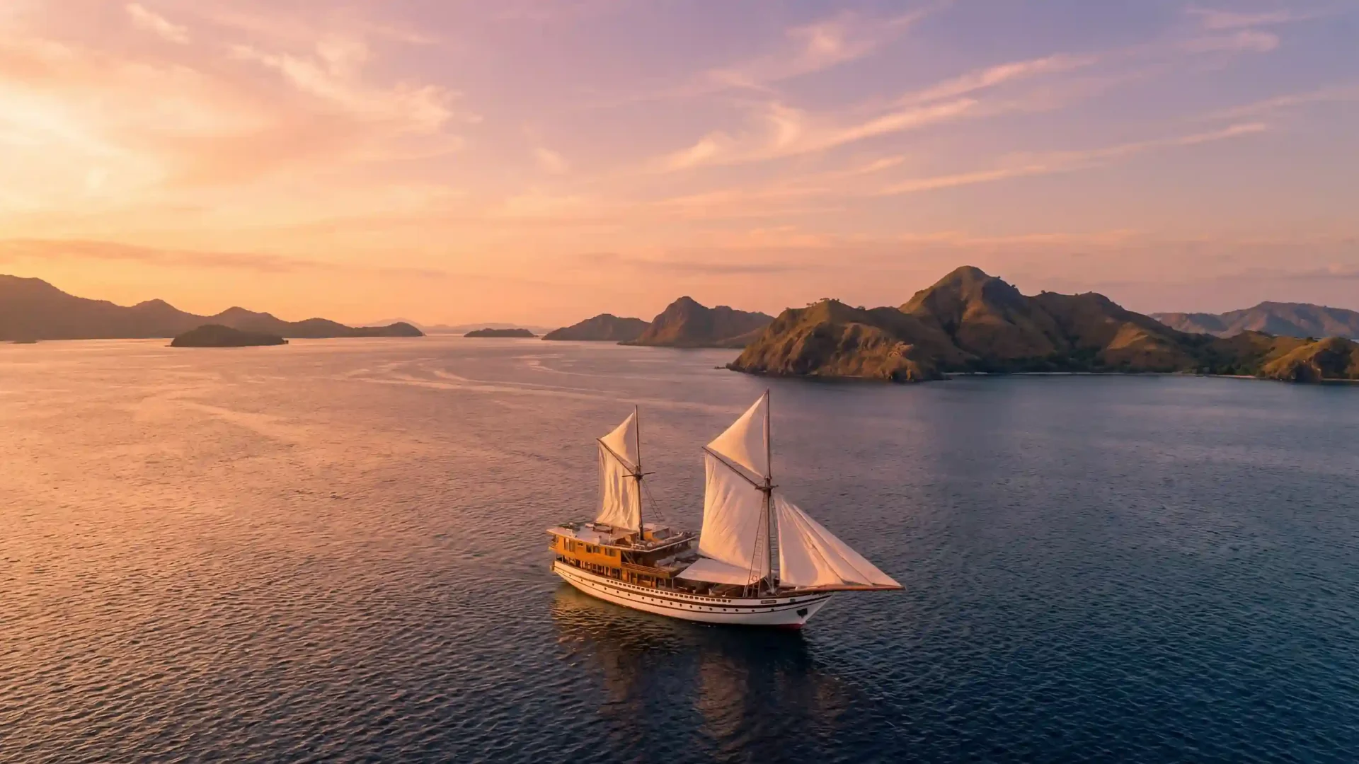 Phinisi Prana under full sail off Komodo