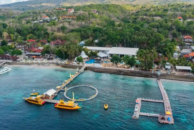 Aerial view of a beach club and harbour in Nusa Penida