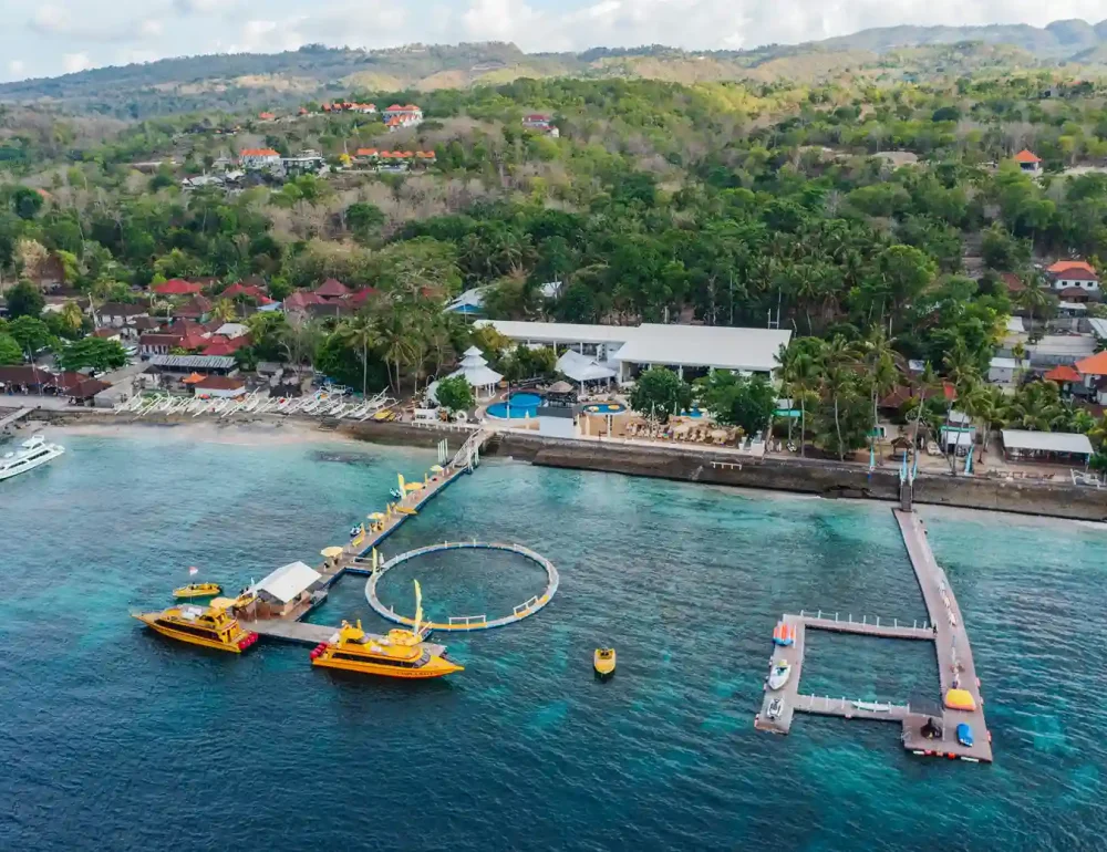 Aerial view of a beach club and harbour in Nusa Penida